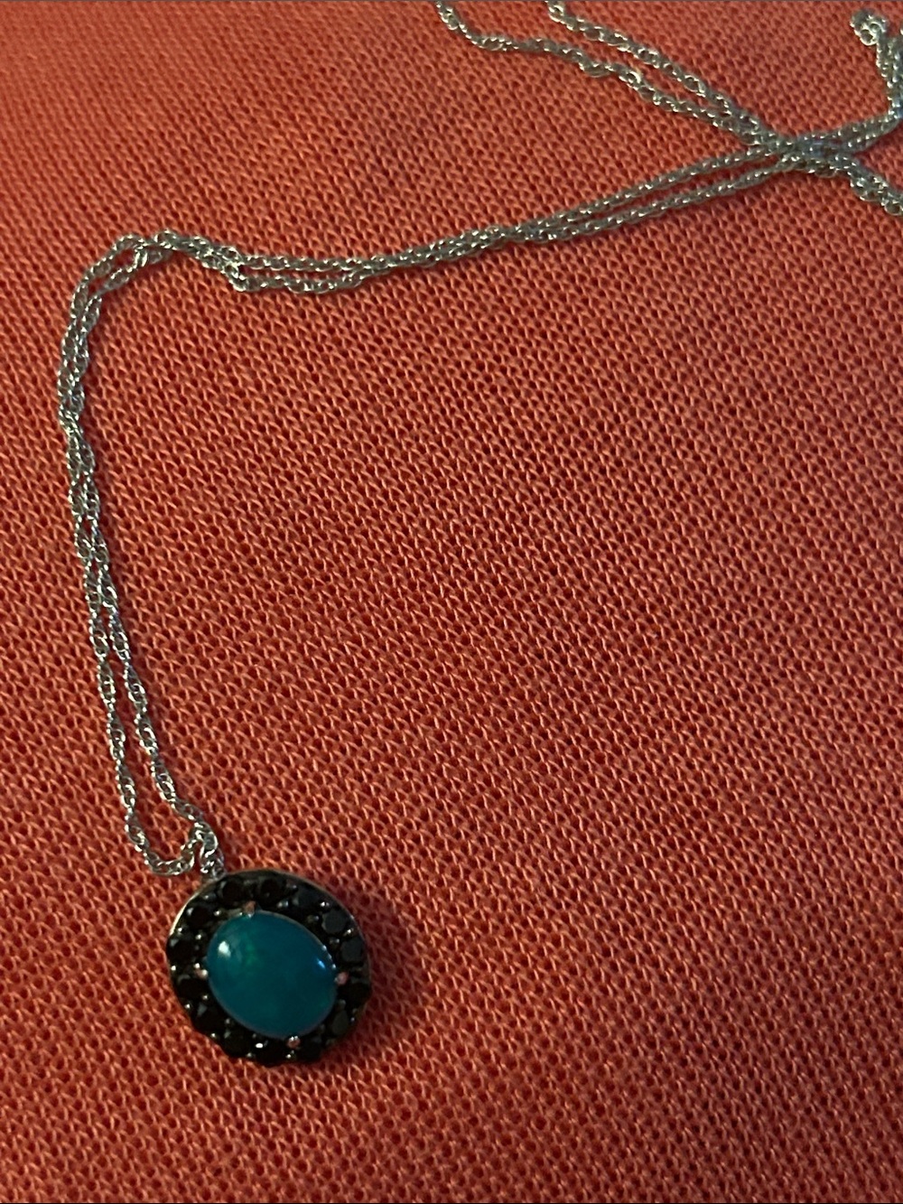 Savvy Cie sterling silver, blue opal and black spinel pendant necklace.